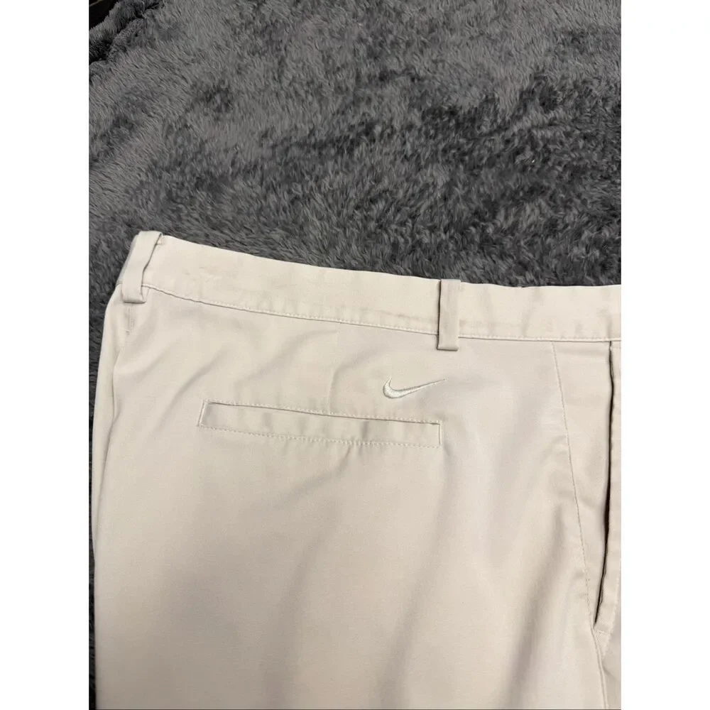 Nike Golf Tour Performance Khaki Shorts, Size Men’s 38. Color is beige.
